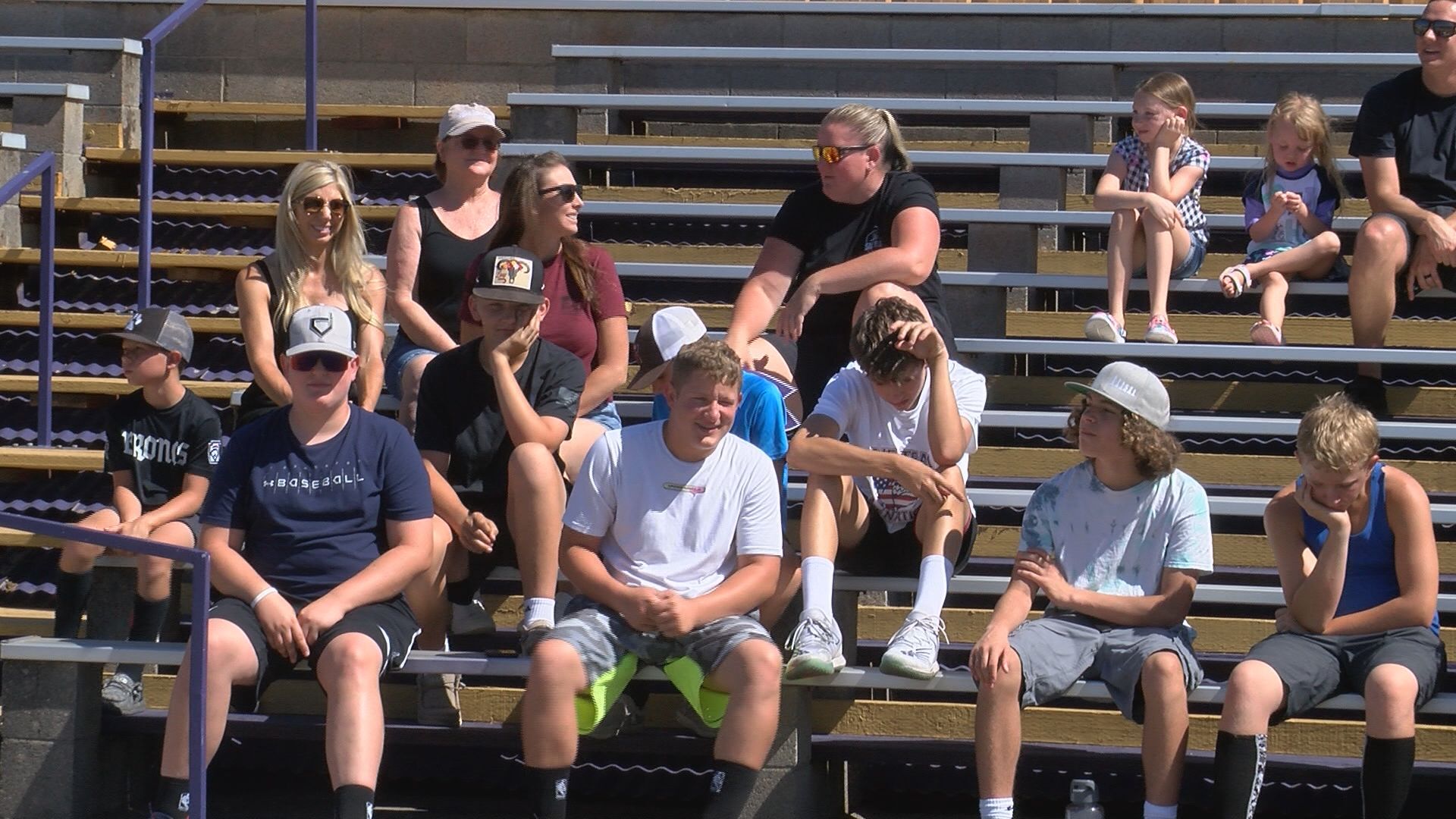 People watch scoreboard dedication ceremony